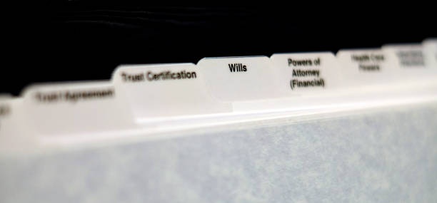 Estate Planning Documents with Tabs for Wills Power of Attorney and Trust stock photo