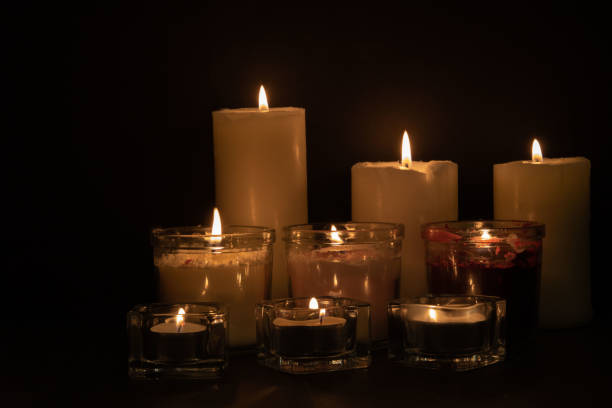 istock photo of lit candles in a row 1443570581