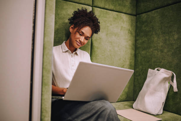 istock Concentrated young woman working on her portable computer 1443570804