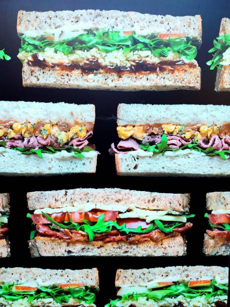 Sandwich slices with bacon rocket egg at London england uk
