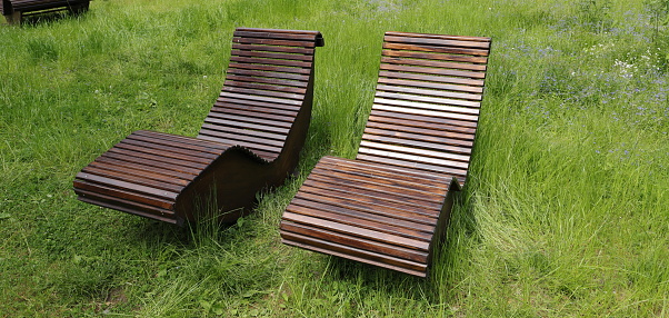 Wooden bench with metal broken in a public park