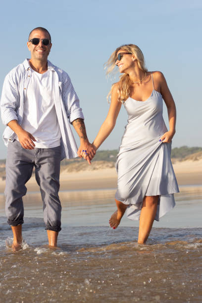 istock Active Caucasian couple spending time at beach 1443575348