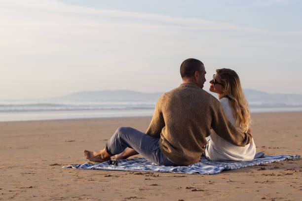 istock Tender couple at picnic at sunset 1443576445