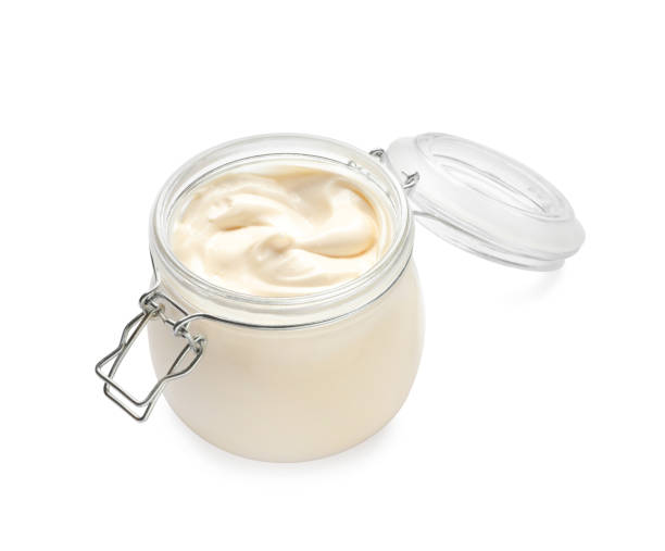 istock Mayonnaise in glass jar isolated on white 1443576562