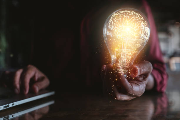 istock light bulb in hand and brain icon Concept creative idea and innovation 1443577200