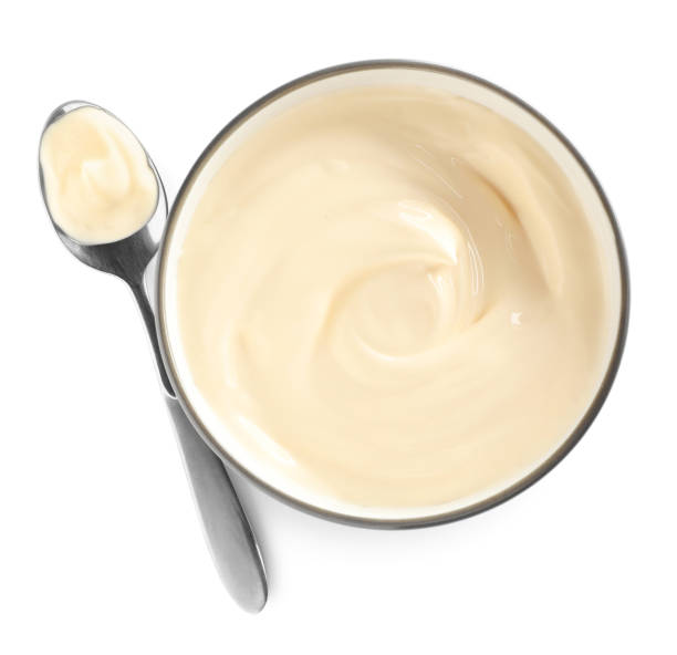 istock Ceramic bowl and spoon with mayonnaise on white background 1443577367