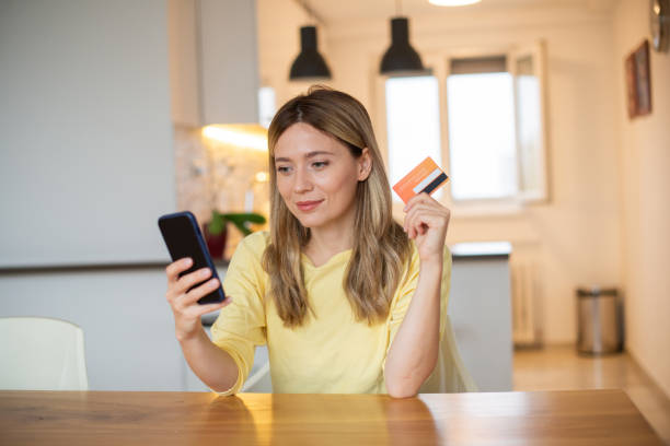 istock Happy young woman using phone 1443578818