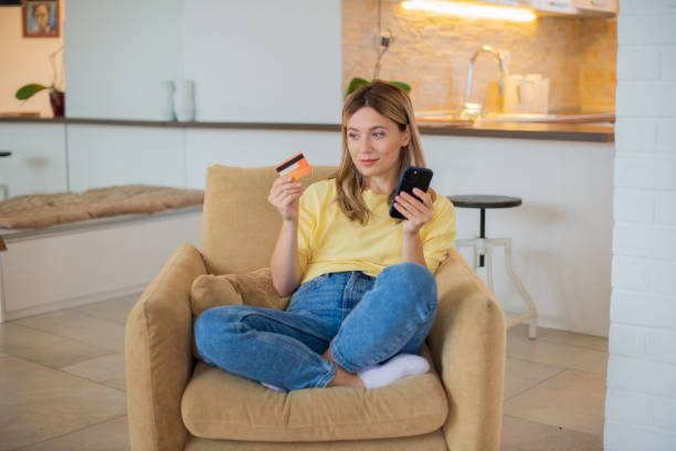 istock Happy young woman using phone 1443578946