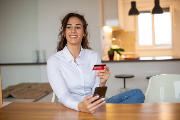 istock Happy young woman using phone 1443579190