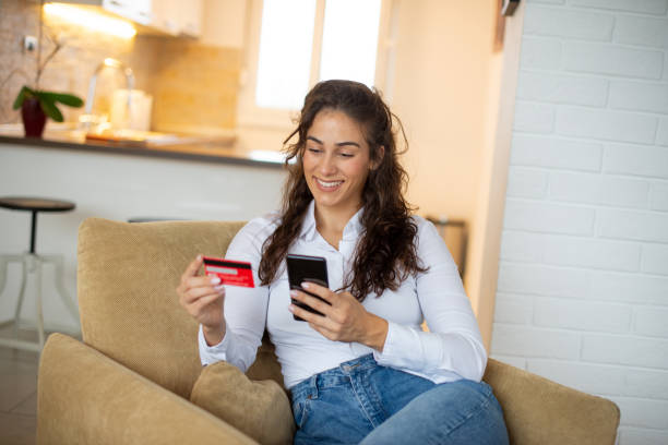 istock Happy young woman using phone 1443579262