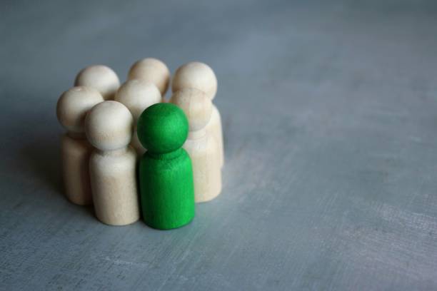 istock Group of wooden dolls with two different color. 1443579271