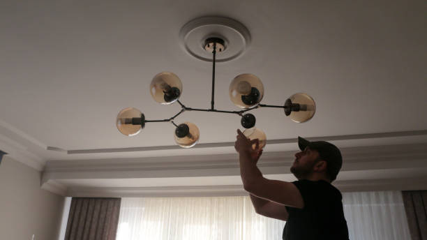 istock Young man wearing chandelier for decoration 1443580739