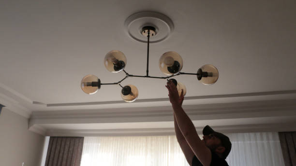 istock Young man wearing chandelier for decoration 1443580879