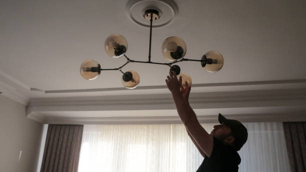 istock Young man wearing chandelier for decoration 1443580970