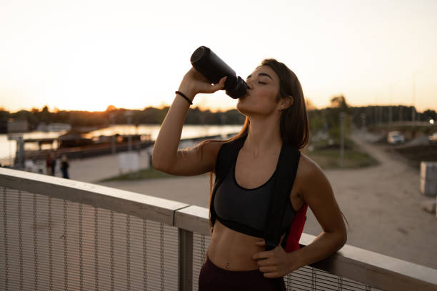 istock Attractive female athlete taking a short break from training 1443581154