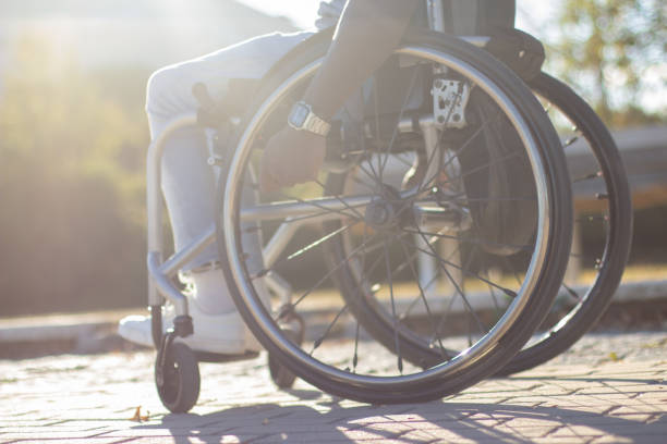 istock Black man in wheelchair spending time in park 1443581363