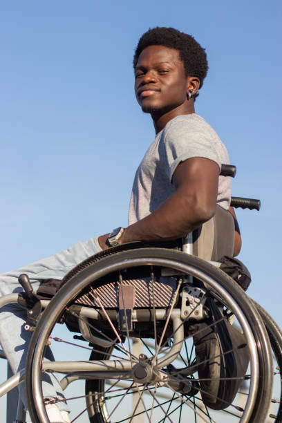 istock Confident Black man in wheelchair enjoying time outside 1443581373