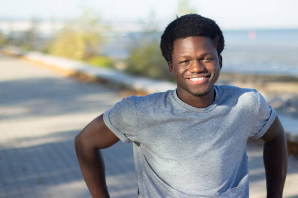 istock Happy Black guy spending time in city park 1443581415