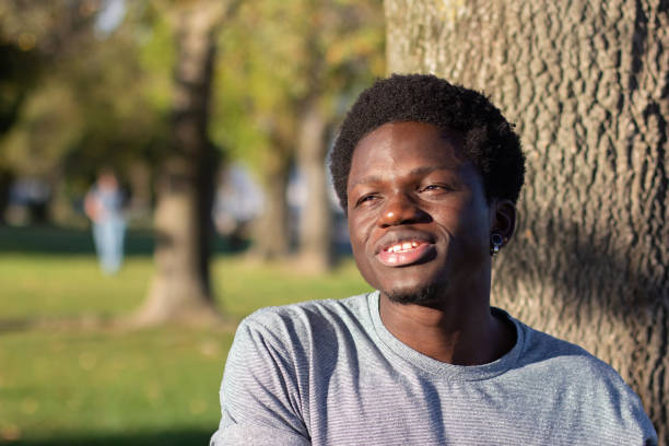 istock Young Black guy spending time outdoors in city park 1443581432