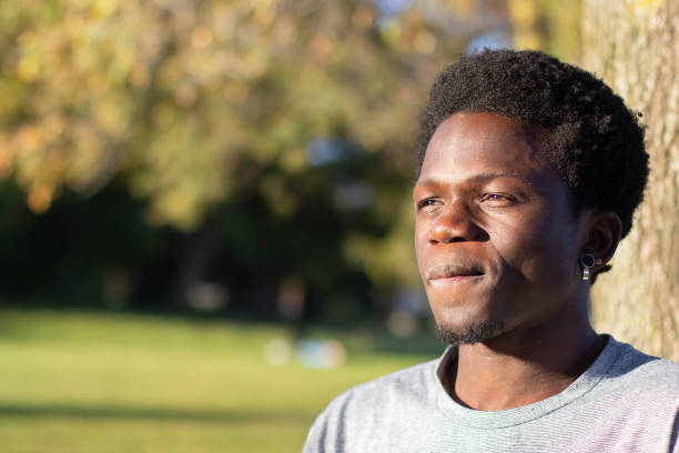 istock Thoughtful Black guy spending time outdoors in city park 1443581446
