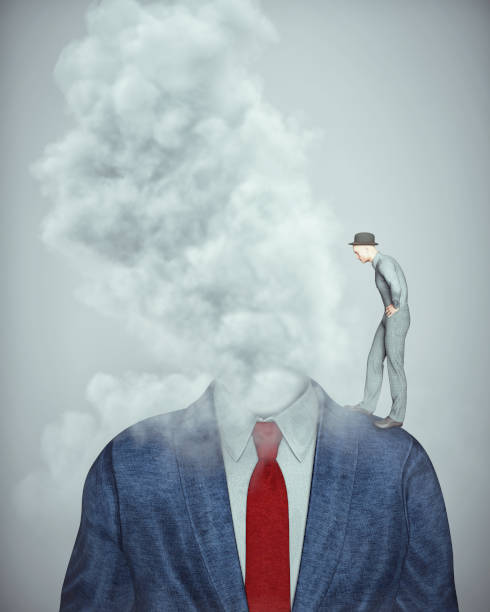 istock Man stands on a headless businessman and a cloud. Burnout and stress concept. 1443585362