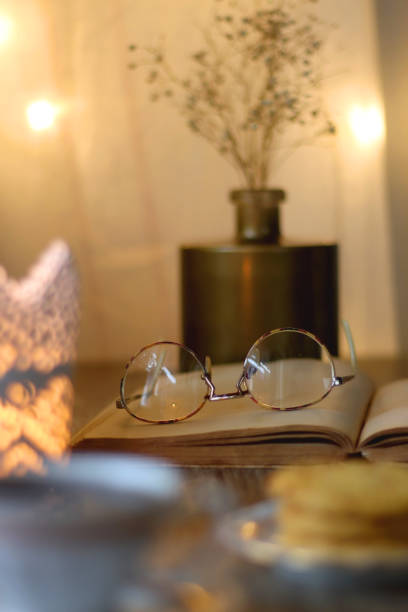 istock Peanut Butter Cookies, Tea, Book, Glasses and Candle 1443587924
