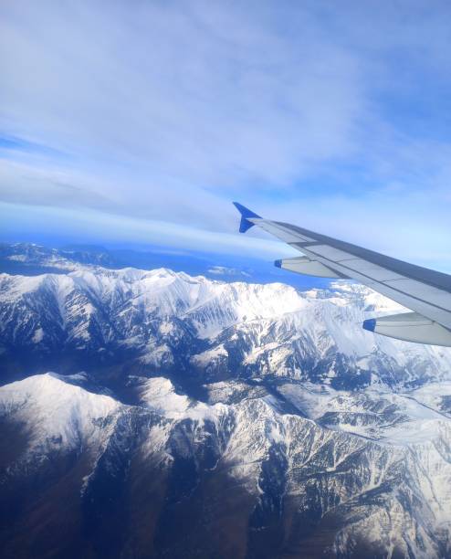 istock Aeroplane view of snowy mountains 1443588035