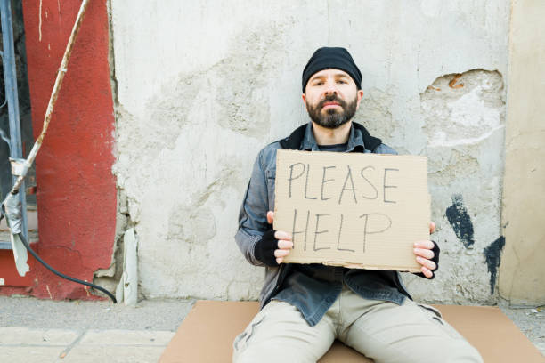 istock Hispanic poor homeless man struggling on the streets 1443592517