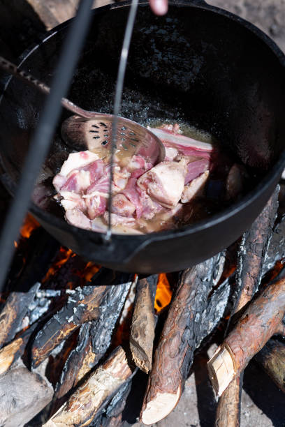istock Cooking meat on ribs in a cauldron 1443594139