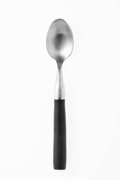 istock Wooden silver spoon isolated on white background. 1443601147