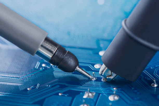 istock Measuring electronic signal using oscilloscope on the PCB. Electronics repair and digital technology. 1443604532