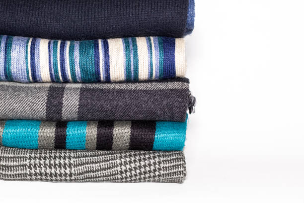 istock A stack of some folded woolen scarves on a white background 1443604630