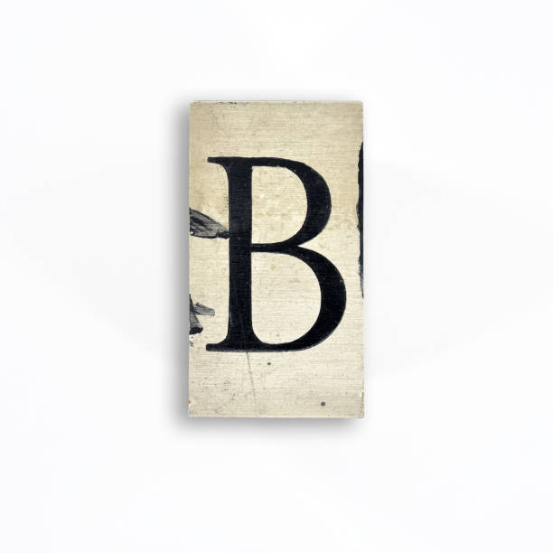 istock capital letter with serif on wood smeared with paint on white background, alphabet - B 1443606580