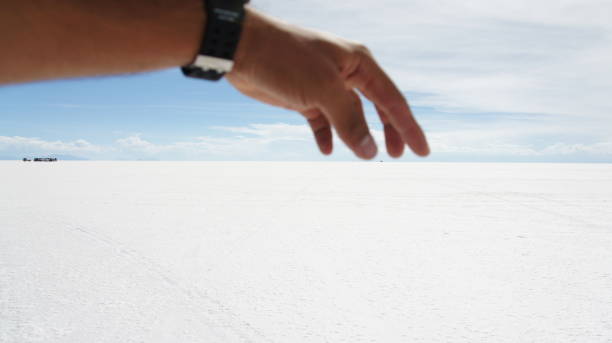 istock Hand catching in Salar de Uyuni horizon 1443607108