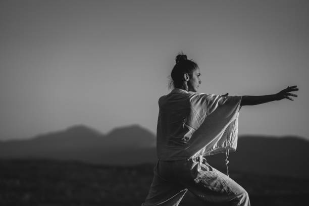 istock Woman doing tai chi 1443608982