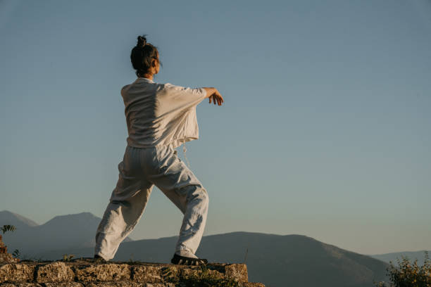istock Woman exercises tai chi 1443609048