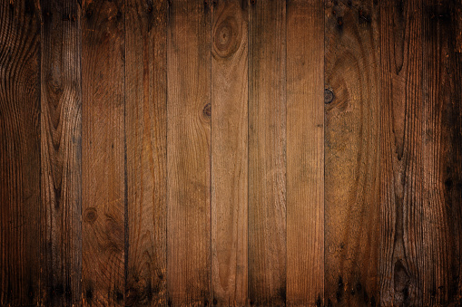 Dark wooden background of vintage vignette weathered wood planks