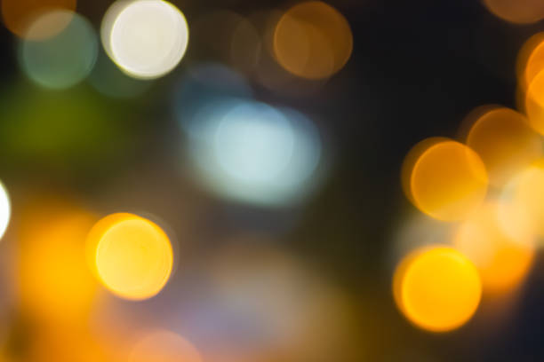 istock Abstract city lights blur blinking background. Soft focus horizontal long banner. Bokeh sparkles colorful defocused on dark texture for night party city. Abstract blurred pattern template. 1443612494