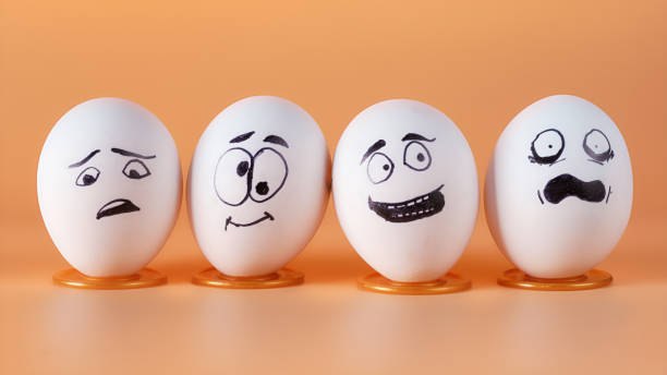 istock Four eggs with painted funny faces representing people in different emotional states 1443613634