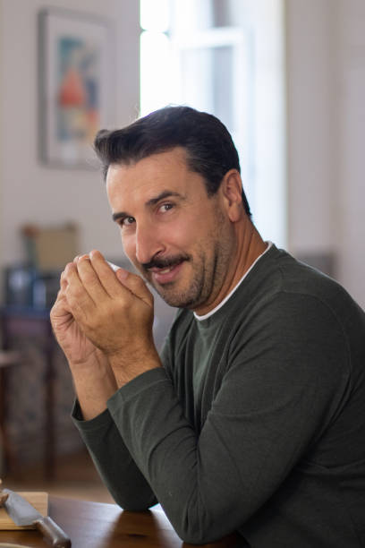 istock Handsome man drinking coffee in morning and looking at camera 1443615192