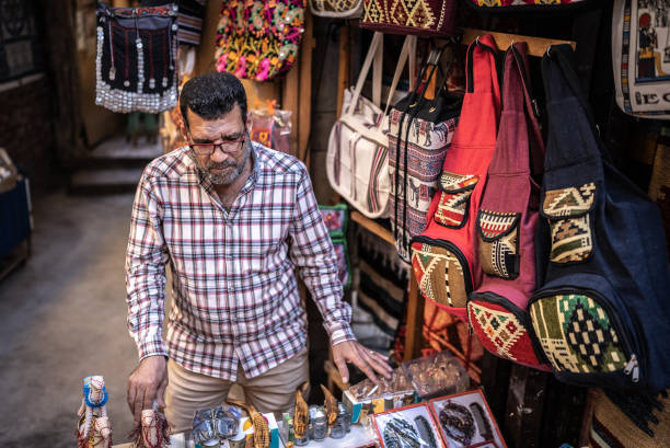 istock Business owner arranging things in his store 1443615504
