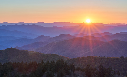 A Blue Ridge Mountain sunset along the Blue Ridge Parkway with mountain layers and soft silhouette