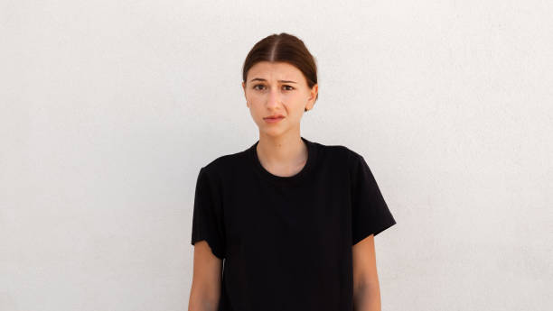 istock Portrait of distrustful young woman looking at camera 1443620151