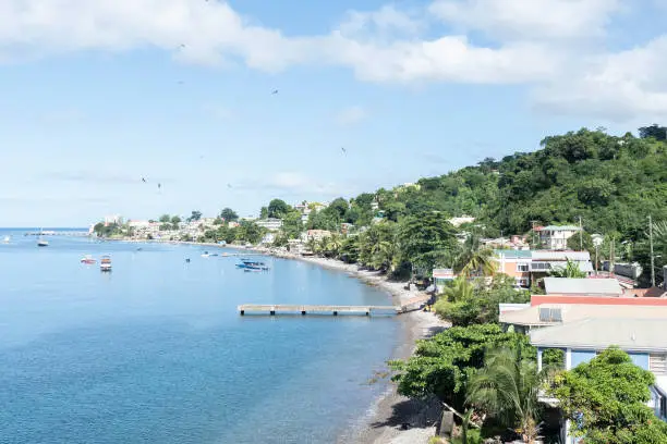 Rocky beach in Dominica, Roseau. Caribbean coastal city with access to the sea