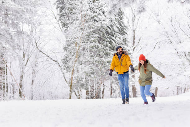 istock Couple running in the snow 1443624652