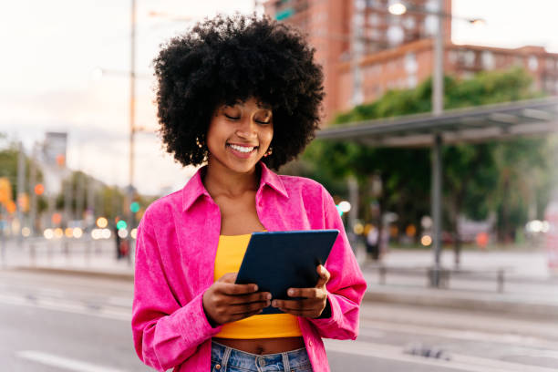 Beautiful young black woman outdoors in the city stock photo