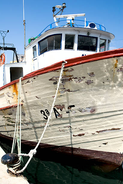 istock old fishing boat moored in harbour 144362486
