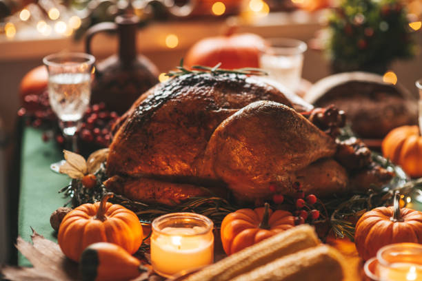 istock Thanksgiving holiday dinner table setting with fall decoration and pumpkins 1443624876