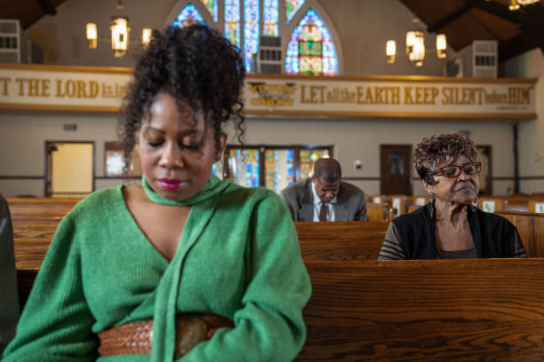 istock Black Congregation attend Black Baptist Church service 1443625173