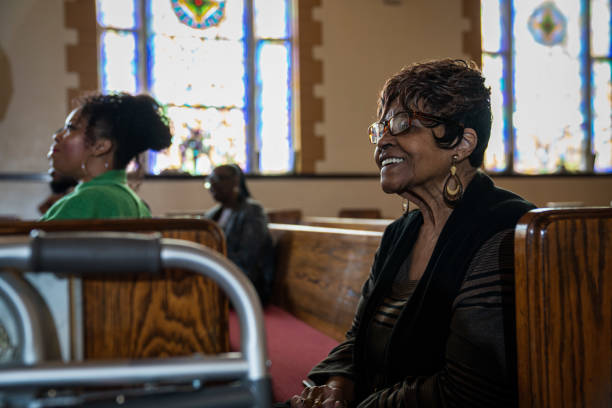 istock Black Congregation attend Black Baptist Church service 1443625282